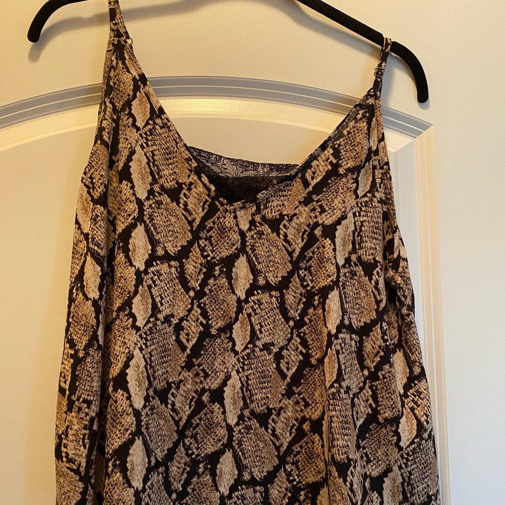 Animal print “silky” cami with lace detail on chest.